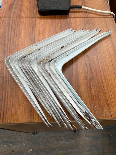 White metal shelving brackets - shelving,